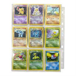 Collection of mainly vintage Pokemon cards including Charizard Base Set Holographic number 4/102 and two Ancient Mew 2000 promo cards, some housed within plastic wallets and some loose