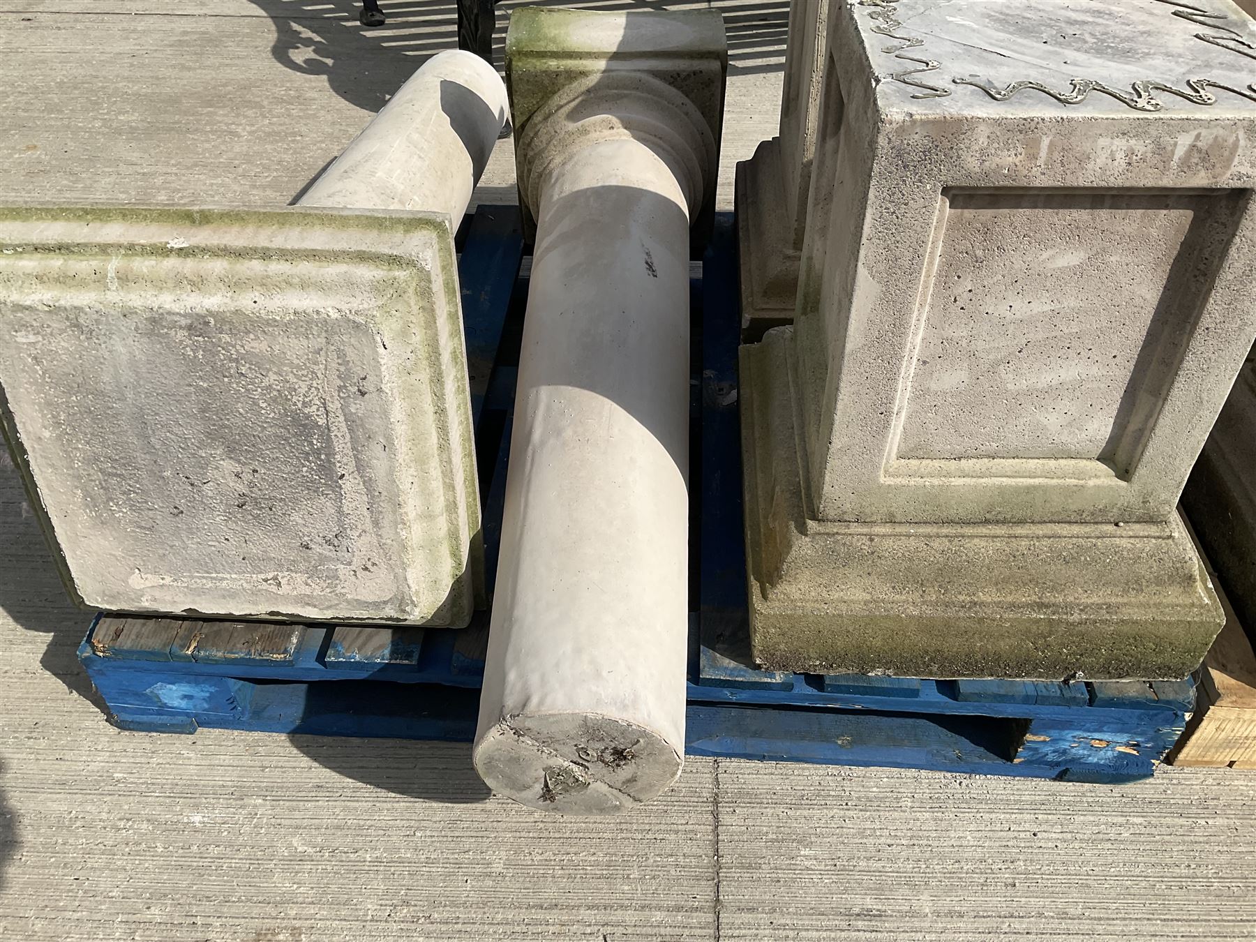 Set of four cast stone architectural columns, tapering form, on square plinth bases