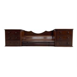 Victorian mahogany correspondence or trinket stand, two banks of three small drawers flanking long central drawer