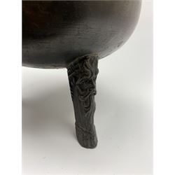 17th century bronze cauldron, probably German or Austrian, of bellied form with twin angular handles supporting a twisted handle, upon three splayed zoomorphic bearded mask feet, not including handle H30cm, rim D22cm