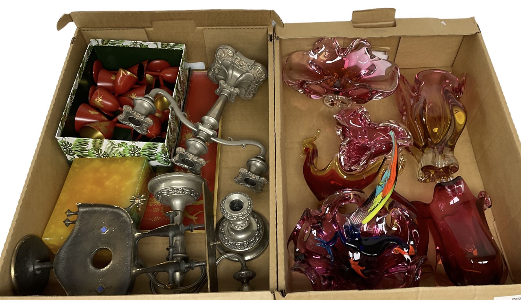 Two silver plated twin branch candelabras and candlestick, together with a coppered effect candlestick, cranberry art glass etc