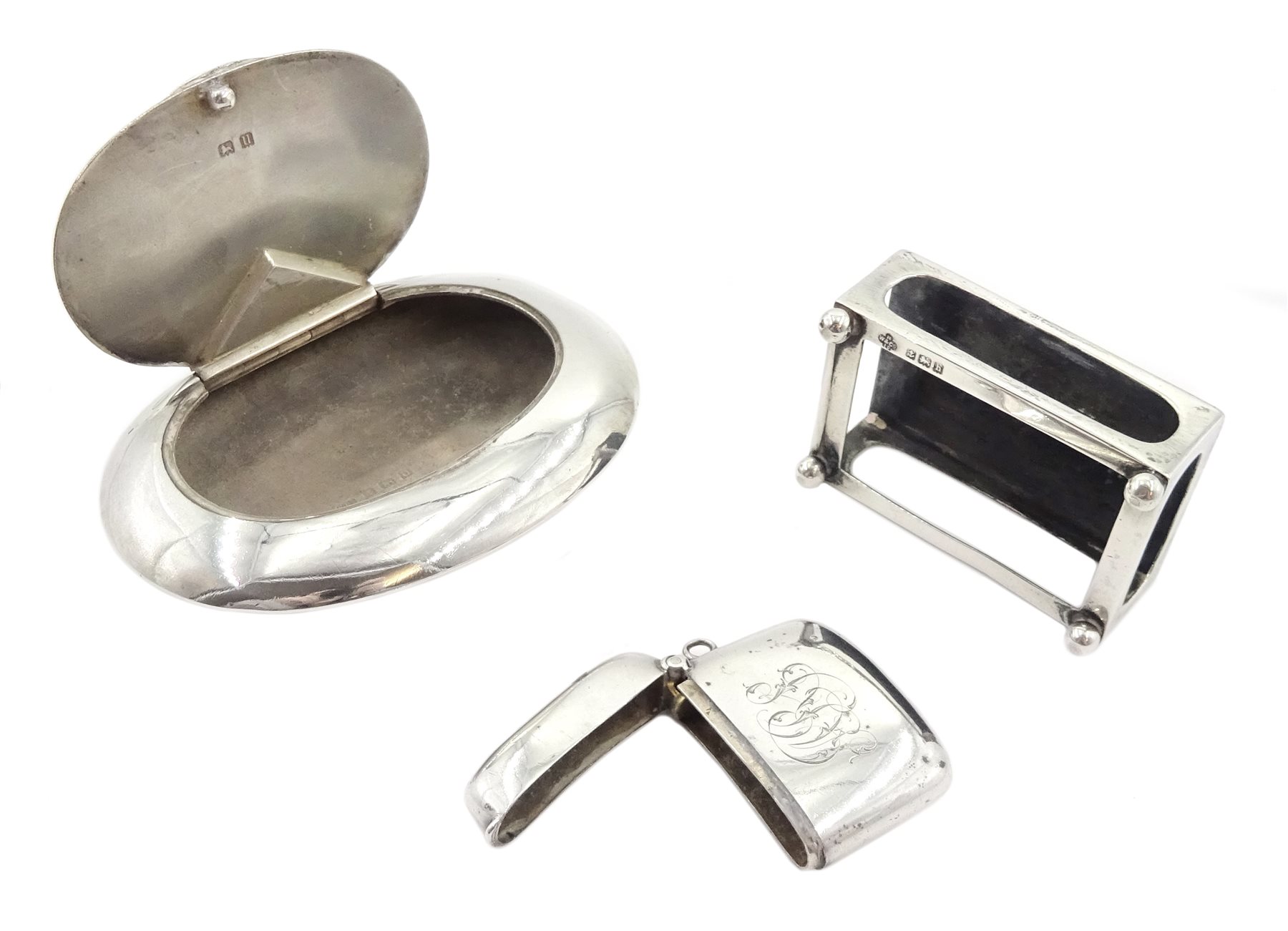 Silver oval shaped snuff box by Henry Williamson Ltd, Birmingham 1919, silver matchbox holder by Horace Woodward & Co Ltd, Birmingham 1907 and silver vesta case hallmarked, approx 4.4oz 