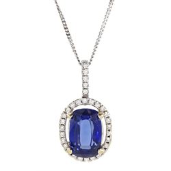 18ct white gold sapphire and diamond halo pendant necklace, single cushion cut sapphire of approx 4.65 carat, with round brilliant cut diamond surround and bail, on fine flattened curb link chain necklace, both hallmarked, total diamond weight approx 0.35 carat