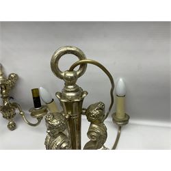 Siz branch silvered chandelier, decorated with acanthus leaves and putti, together with two matching three branch wall sconces, chandelier D65cm