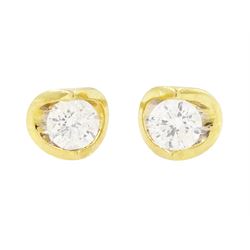 pair of 18ct gold diamond earrings, each stud set with a single round brilliant cut diamon...