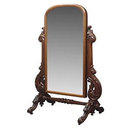  Victorian mahogany Cheval mirror, arched swing plate on acanthus scroll carved supports, four out splayed feet on castors, H159cm  