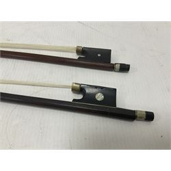 Two wooden violin bows