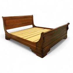 Willis & Gambier - 20th century mahogany sleigh bed, panelled headboard and footboard with scroll terminals, raised on moulded plinth base