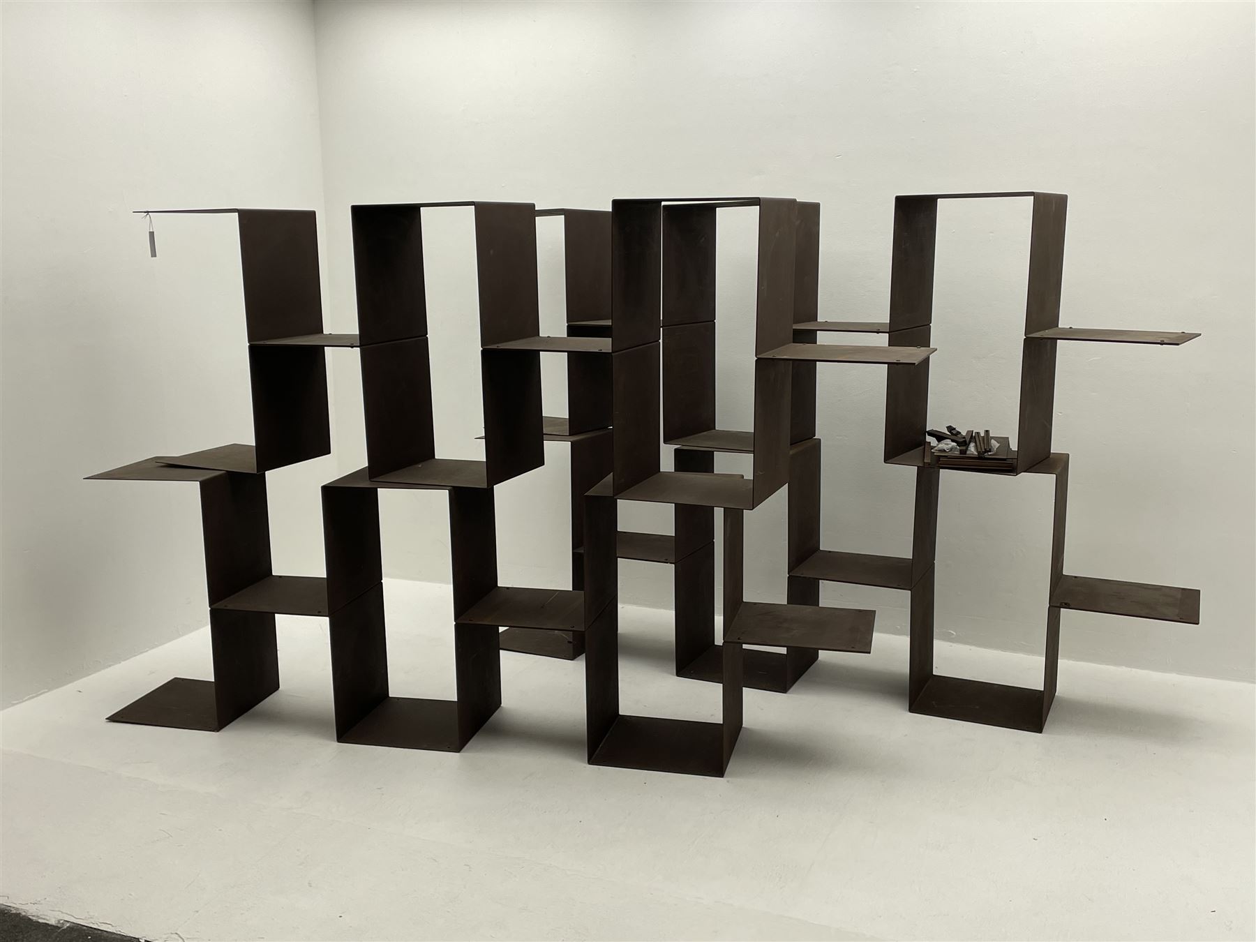 Retailed by The Conran Shop - four sectional modular shelving units, rusted metal finish, each unit - W212cm, H71cm, D33cm