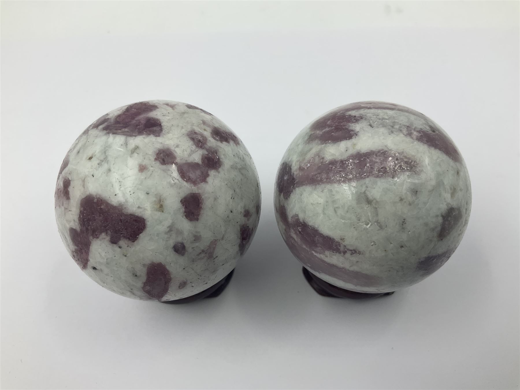 Pair of pink tourmaline spheres, upon gilt metal stands, H9cm D5cm