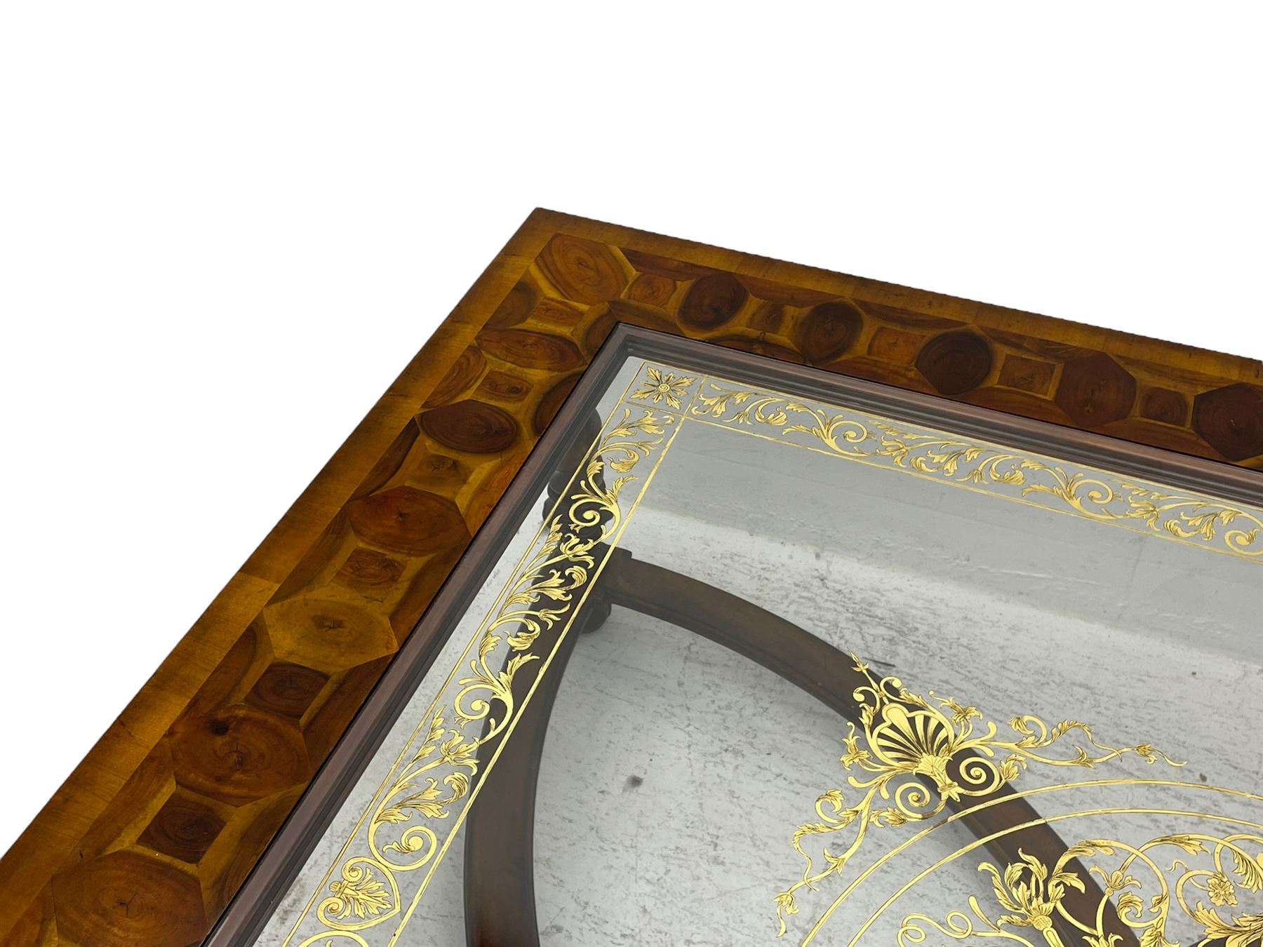 Jonathan Charles - large mahogany coffee table, the square oyster veneered top with verre églomisé inset, the glass hand-painted with gilt scrolling foliate patterns, raised on spiral turned supports with acanthus and gadroon carvings, united by interlocking demi-lune stretchers, on scrolled acanthus feet