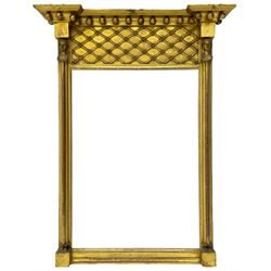 Regency period giltwood and gesso pier glass mirror, projecting globular cornice over basket lattice frieze, two half column pilasters with Egyptian mask capitals enclosing bevelled plate