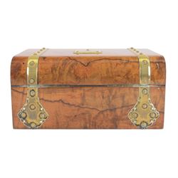 19th century walnut and brass bound games compendium box, painted to enhance the grain, of rectangular form, the hinged opening cover with rounded sides, central brass cartouche with engraved lion crest, and brass riveted straps, opening to reveal a red leather and blue silk lined compartmented interior, with fold-down games board, and lift-out tray containing playing cards, ebony turned dice towers, white and red stained bone draughts, and chess pieces, ivory dice, and ivory and ebony whist markers, and brass bezique board, cribbage board and markers, H15cm W32cm D24cm
This lot has been registered for sale under Section 10 of the APHA Ivory Act