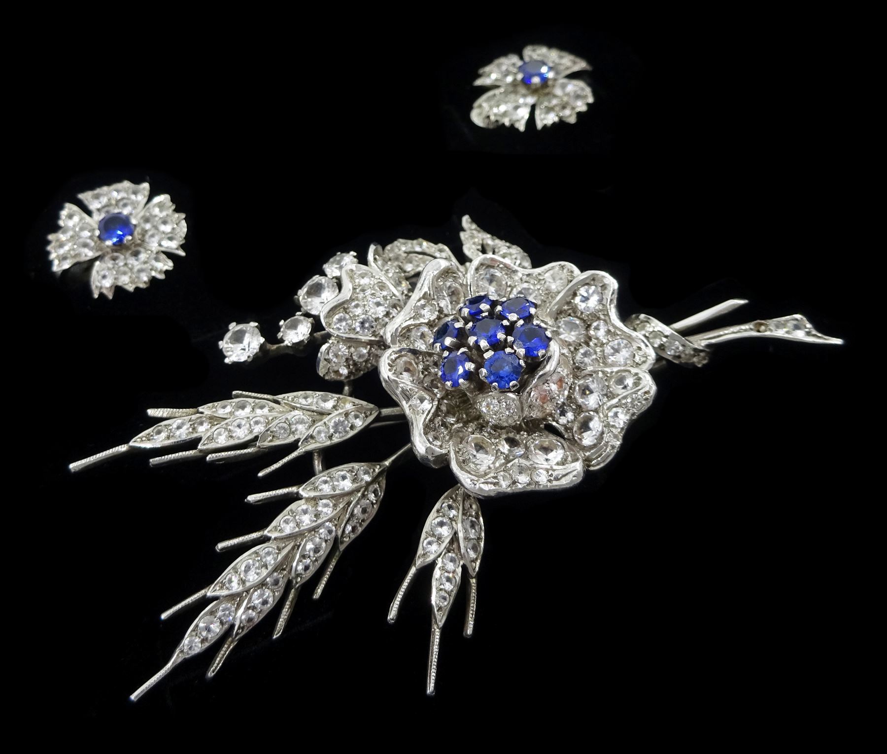 Silver synthetic sapphire and white paste stone set flower necklace, brooch and matching pair of earrings, stamped sterling