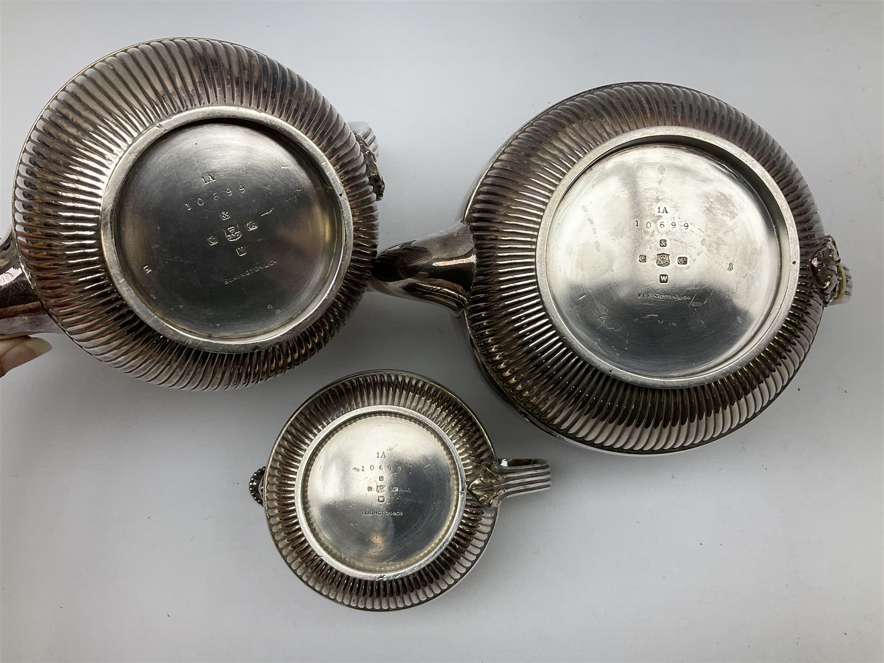 Elkington & Co. silver plate tea set, consisting teapot, coffee pot and milk jug, with engraved foliate decoration and a beaded edge