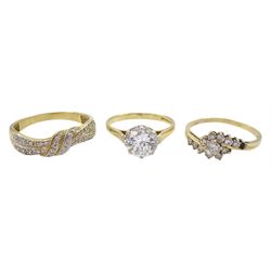Gold diamond cluster ring, gold diamond crossover ring and a gold single stone cubic zirconia ring, all hallmarked 9ct 