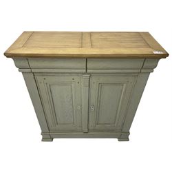 Painted oak side cabinet, rectangular oak top over two drawers and two panelled cupboards, the interior fitted with two adjustable shelves, on stepped plinth base with compressed block feet, in washed laurel green paint and waxed finish
