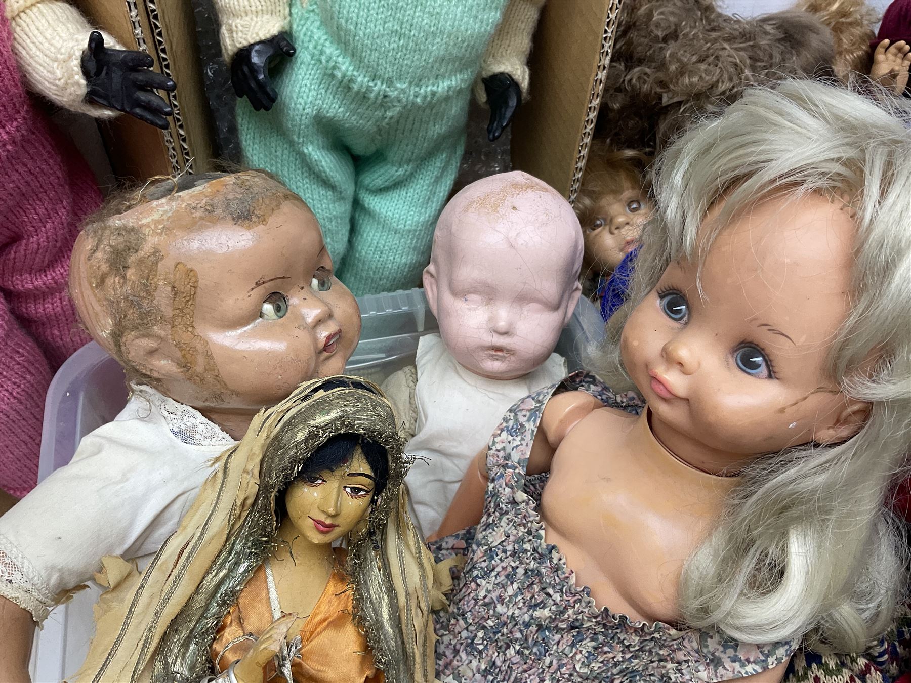 Quantity of vintage and later dolls to include unusual three faced example and further dolls marked C.J, Gloobee, Rosebud etc in three boxes