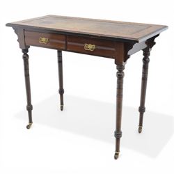 Edwardian mahogany writing table, tooled leather top over two frieze drawers, on turned supports terminating in castors