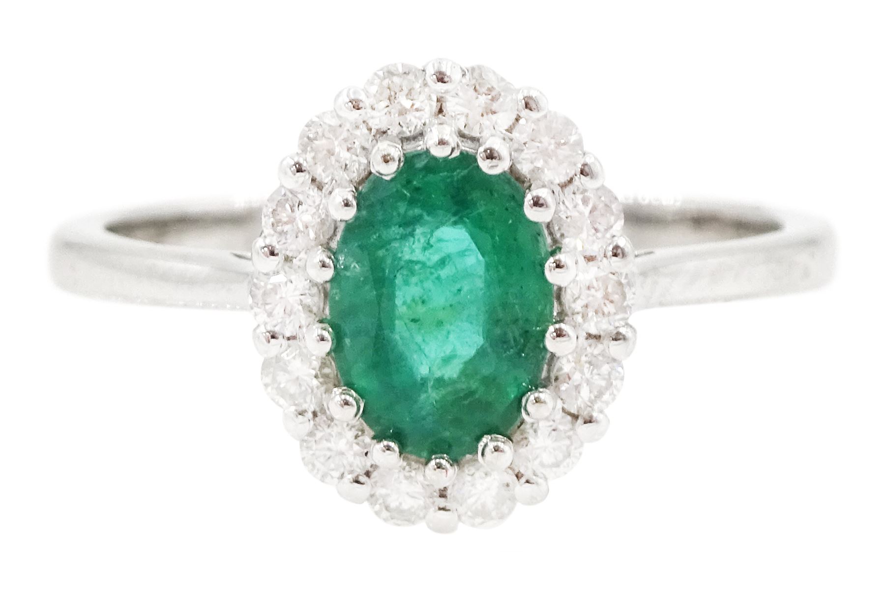 18ct white gold oval cut emerald and round brilliant cut diamond cluster ring, emerald approx 0.85 carat, total diamond weight approx 0.30 carat