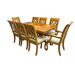 Yew wood extending twin pedestal dining table, rectangular top with ebony stringing over turned and reeded vasiform pedestals on tripod bases, with two additional leaves (W159cm D92cm); and set of eight (6+2) matching dining chairs, high pierced backs over seats upholstered in ivory fabric, on cabriole supports (W57cm H101cm)