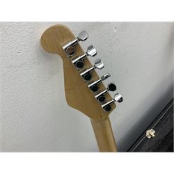 Fender style sunburst electric guitar with manuscript mark 'Zenta Stratocaster 1963' L97cm; in hard carrying case; another similar unmarked sunburst electric guitar; in gig bag; and Fender Frontman Amplifier, serial no.M473406 (3)