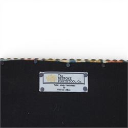 Pair of needlepoint footstools, retailed by The Bespoke Footstool Co, brass studded trim on tapered oak supports