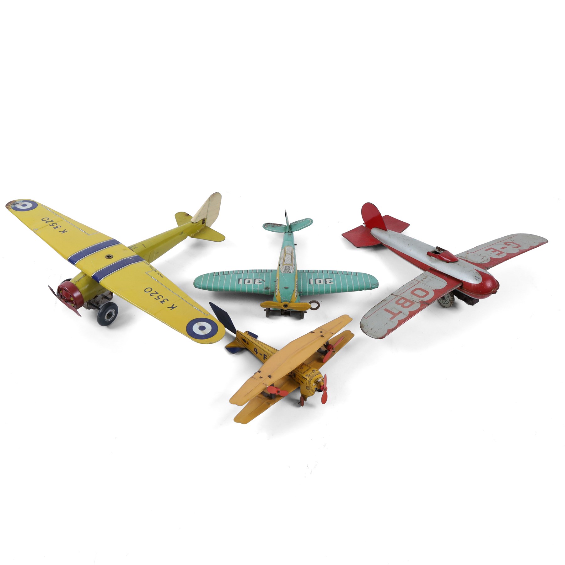 Four tinplate model aeroplanes, comprising Mettoy clockwork single-engined model no. K3520 in yellow with blue stripes and red engine cowl, Mettoy clockwork monoplane with silver and red lithographed body, Wells of London clockwork aeroplane no. 301 in green with lithographed details and a  small German bi-plane in yellow, three clockwork examples with key
