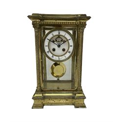 Late 19th century French brass four glass mantle clock by Samuel Marti of Paris, c1880 case on a recessed stepped plinth with four twisted columns and Corinthian capitals to the four corners, with a two- part enamel dial, Roman numerals and minute markers, non matching steel hands and visible Brocot escapement with cornelian pallets, 8-day rack striking movement stamped “medaille de bronze” with chamfered pendulum and key.