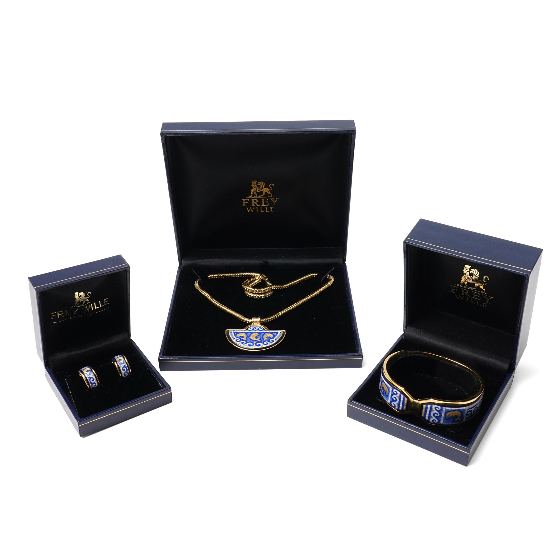 Frey Wille gold plated and enamel suite of jewellery from the Dolphins of Poseidon collection, including a pair of hoop earrings, hinged bangle and pendant on snake chain necklace, all boxed