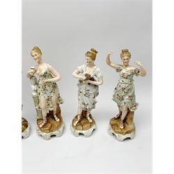 A group of five Continental figurines modelled as the arts, emblematic of music, painting, sculpture, literature, and theatre, each with spurious blue cross mark beneath, H22.5cm. (5). 