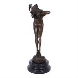 After H Fishmuth; Bronze figure of a nude female holding a vine, with foundry mark on socle base, H38cm