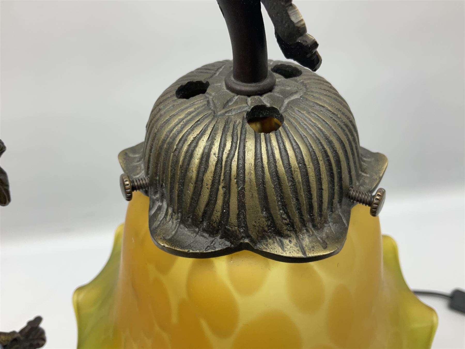 Art Nouveau style lamp in the form of a woman on a swing, with a green mottled shade, upon a marble base H52cm