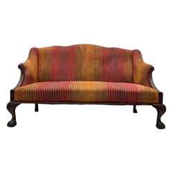 Mid-19th century mahogany two-seat sofa, upholstered in striped velvet fabric, the shaped backrest leading to outward-curved arms, carved apron with scrolling foliate details, raised on cabriole supports terminating in claw and ball feet