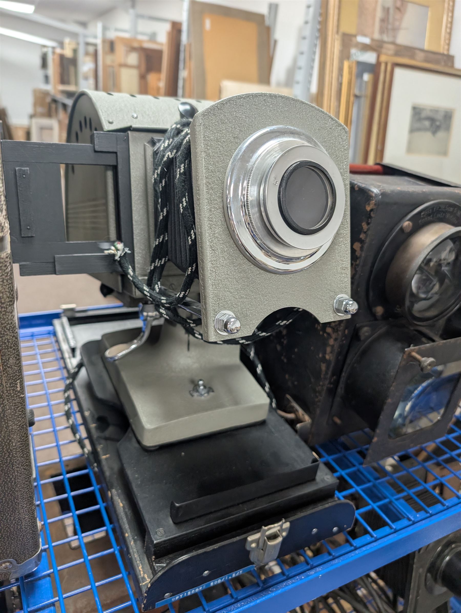 Collection of projectors, epidiascopes, magic lantern and similar, including Bell & Howell 621 projector, mahogany and brass magic lantern, Helper 6S projector, Leitz epidiascope, Zeiss epidiascope, Johnson Optiscope, etc