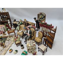Dolls house living room and dining room furniture, including arm chairs, desk, fireplaces, dressers, tables, eight figures and a large collection of predominantly Christmas themed food, accessories and decorations