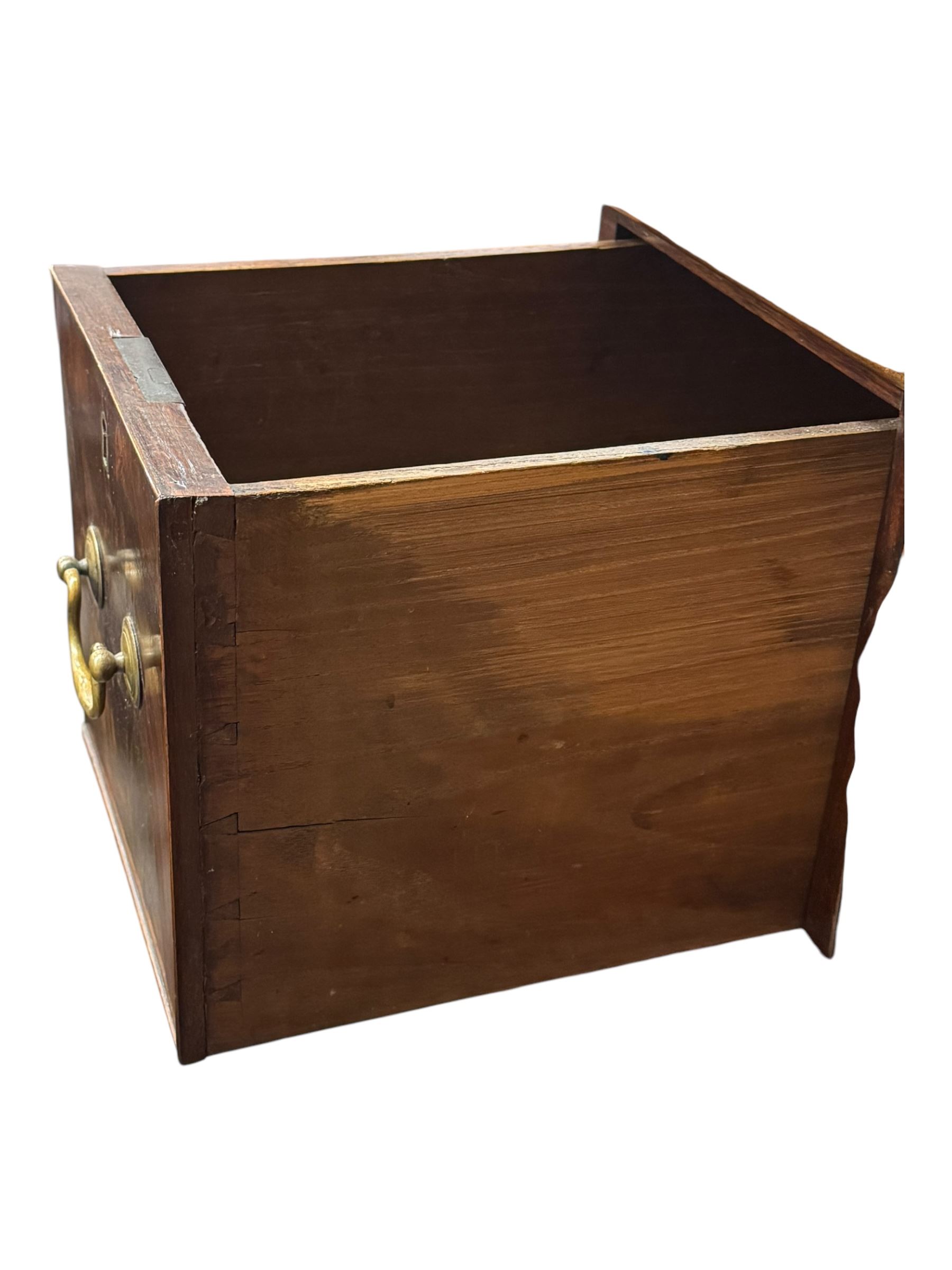 George III mahogany bookcase secretaire, dentil cornice over blind fret work frieze, enclosed by two astragal glazed doors, central secretaire drawer with fall front enclosing leather writing surface and small drawers, two flanking short drawers over double cupboard, on bracket feet