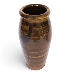 Studio pottery vase by Menston Art Pottery, decorated with brown and green slipware design, H39cm