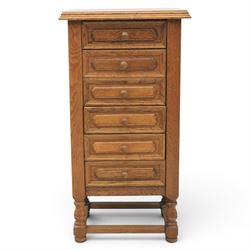 Early 20th century oak pedestal chest, with six drawers with moulded edges, raised on turned supports united by a stretcher 