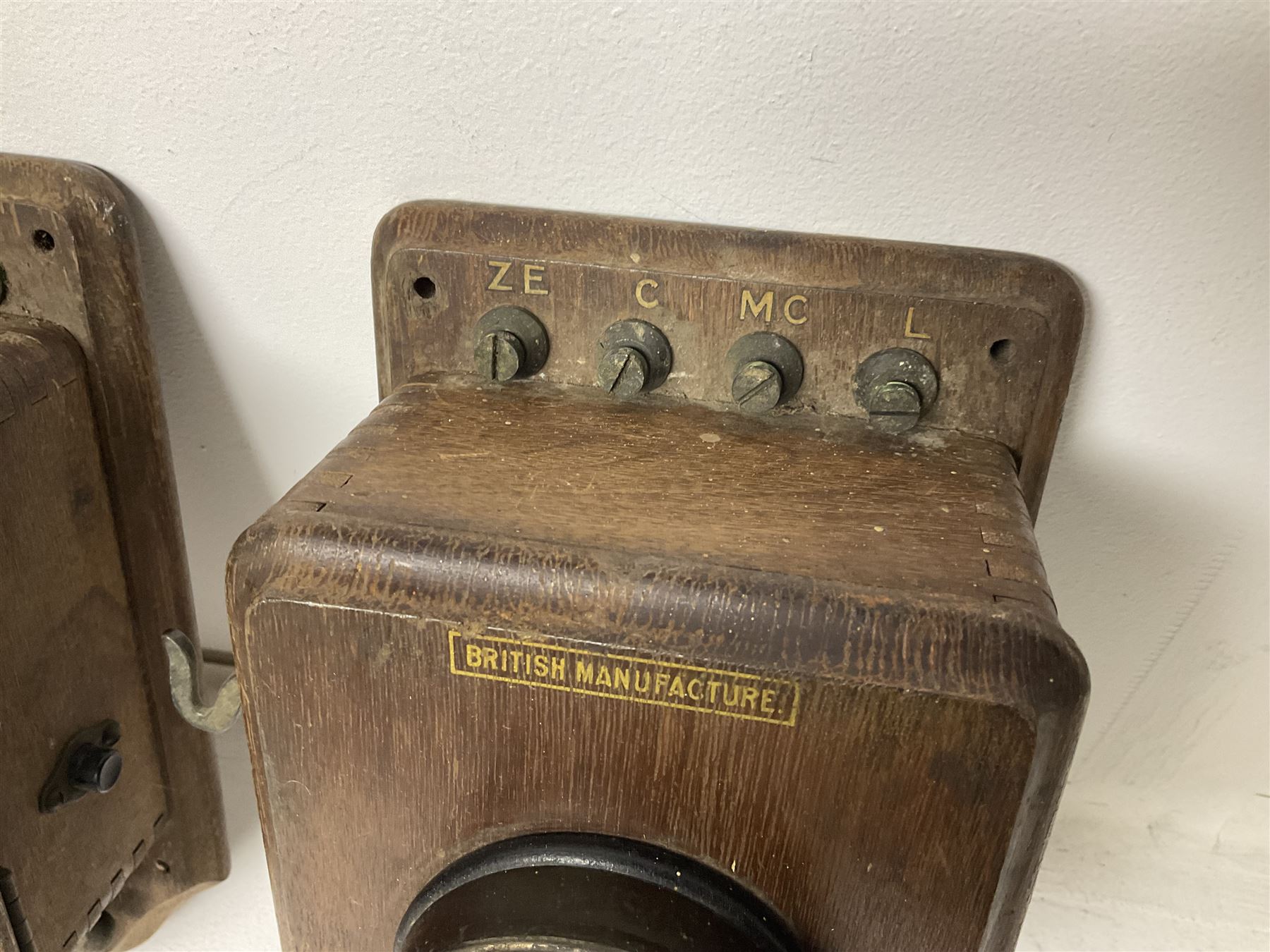 Two Hunningscone patent wall mounting telephones in walnut casing, together with Sterling Telephone & Electric Co. Ltd early wall-mounted telephone 'Primax' and one other 