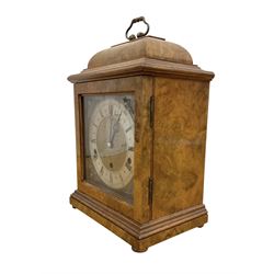 Elliot- late 20th century 8-day walnut bracket clock in an 18th century styled case, with a brass dial, brass spandrels and a slivered chapter ring, three train Westminster chiming movement with a lever balance escapement, chiming the quarters on eight gong rods.