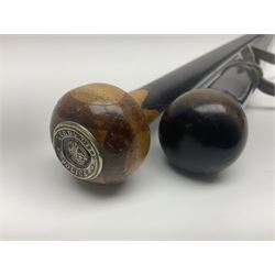 Two ebonised walking sticks, one with 'Leeds City Police' embossed top, tallest H92cm