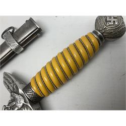 WW2 German Luftwaffe 2nd Pattern Officers dress dagger, with unmarked 25.5cm double edged steel blade, wire-bound pale orange/yellow celluloid grip, globular  pommel with oak leaves and traces of gilding, Luftwaffe eagle cross guard; in beaded scabbard with two suspension rings L43cm overall
