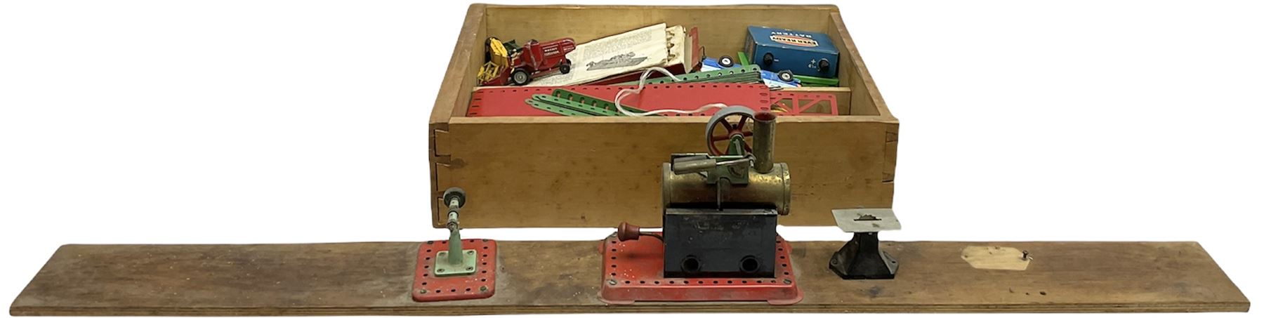 Mamod small stationary steam plant with circular saw bench and grinder mounted on long wooden board L107cm; and quantity of predominantly red/green Meccano in wooden box with die-cast models etc