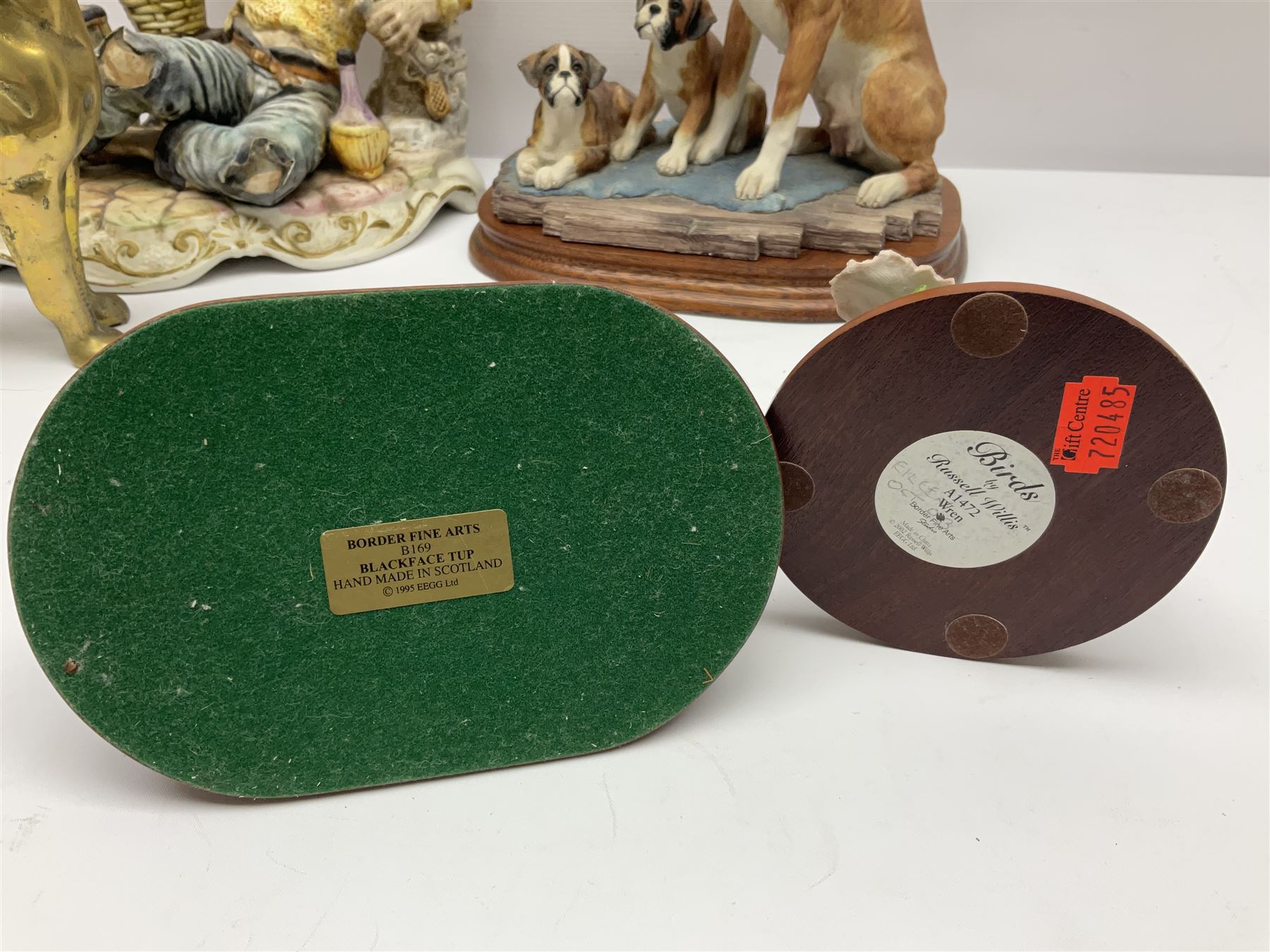 Three Border Fine Arts figures including Boxer with Pups, Capodimonte figure of a drunken pirate, and a brass dog (5)