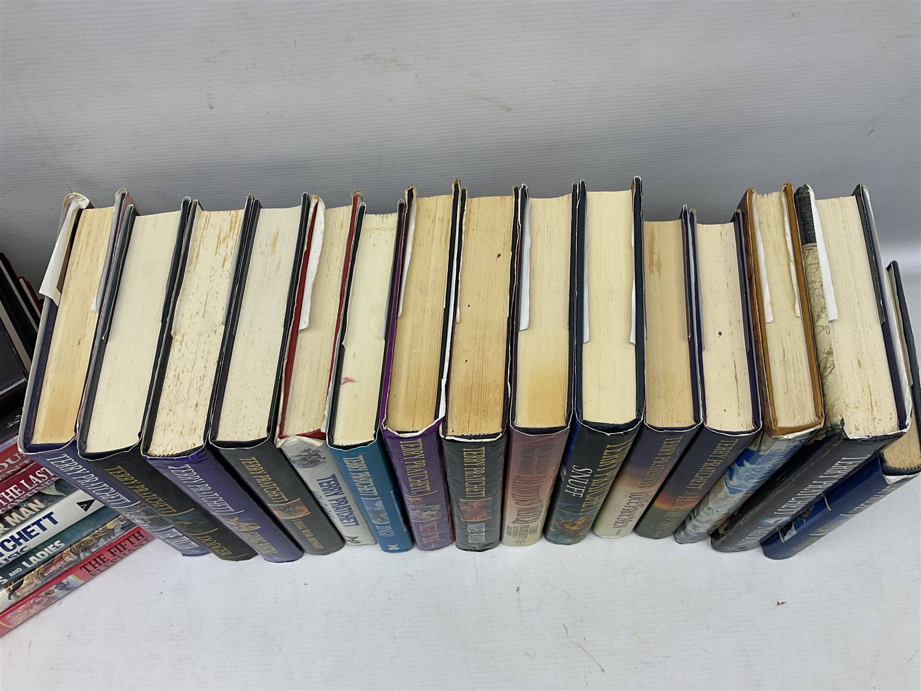 Collection of twenty-three hardback Terry Pratchett books, comprising approximately eighteen first editions including The Fifth Elephant signed & inscribed by Pratchett, all with dustjackets