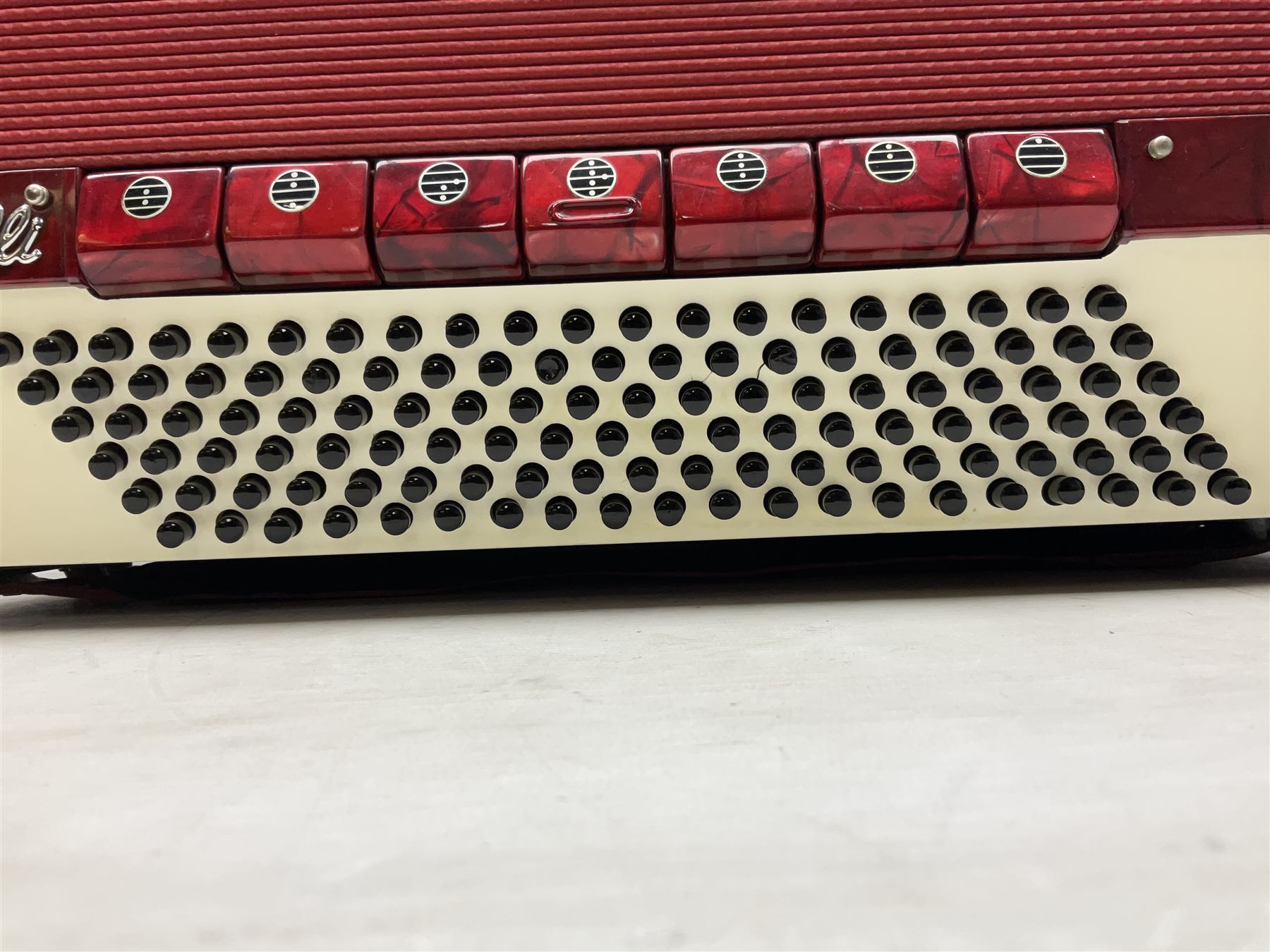 Clinkscale Crucianelli piano accordion in red pearline case with one-hundred and twenty buttons and forty-one keys L52cm; in carrying case