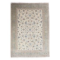 Large Central Persian Kashan hand-knotted carpet, ivory field with small central floral me...