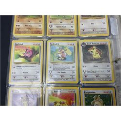 Collection of Pokemon trading cards, mostly 1999 Wizards Pokemon cards to include holo Charizard 4/102, first edition holo Machamp 8/102, further holographic cards; Dark Flareon 35/82 and Dark Vaporeon 45/82, cards from themed sets and 4th edition prints; 1998 Electronic Pokédex with cardboard boxes for themed decks Blackout, Overgrowth and Power Reserve Jungle, along with a large quantity of energy and trainer cards 