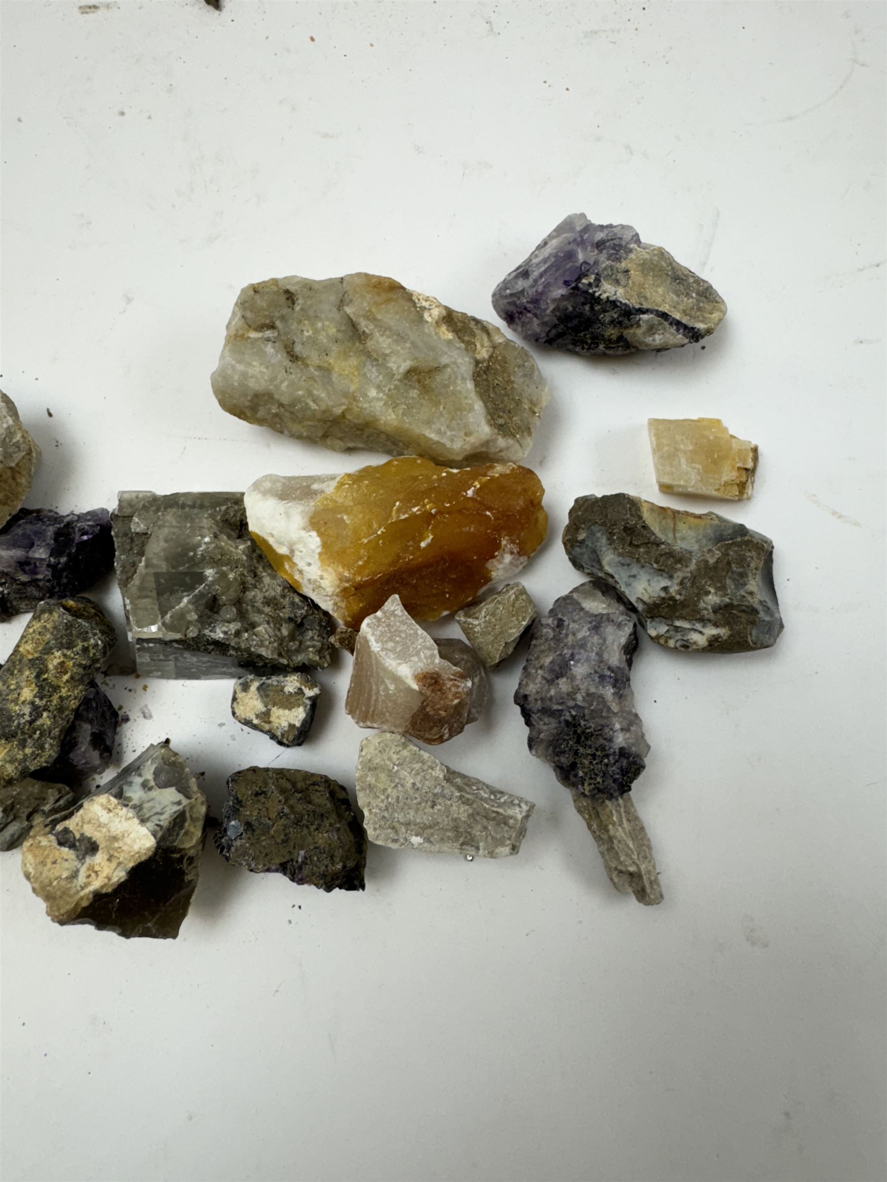 Collection of raw Blue John specimens, together with other mineral specimens